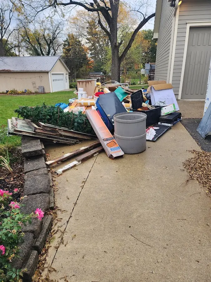 Dumpster being loaded with debris for Estate Cleanout Dumpster Rental in Hillsborough
